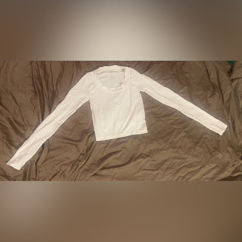 White long sleeve made of stretchy material that is very smooth on the skin